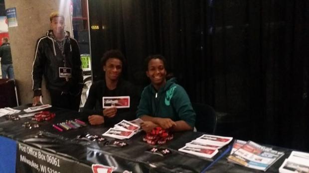 Volunteers at The X-Man Foundation booth during an Admiral's game.